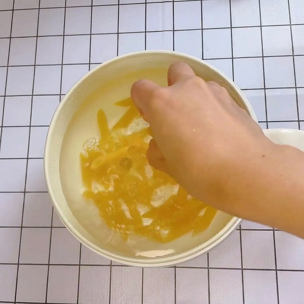 Penne pasta bubbling in a pot of boiling water.