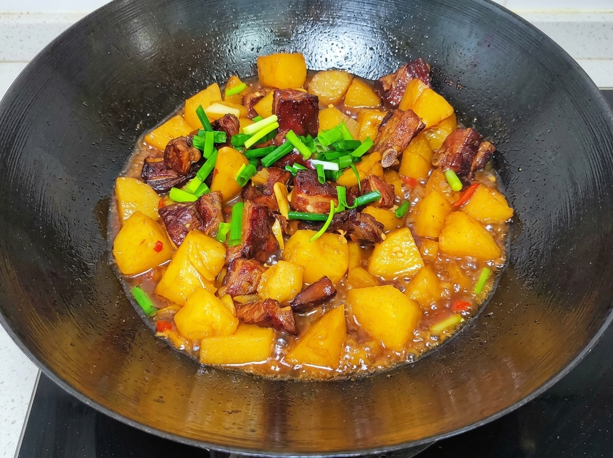 Fresh beef brisket slices, a red onion, and an egg arranged on a clean preparation surface.