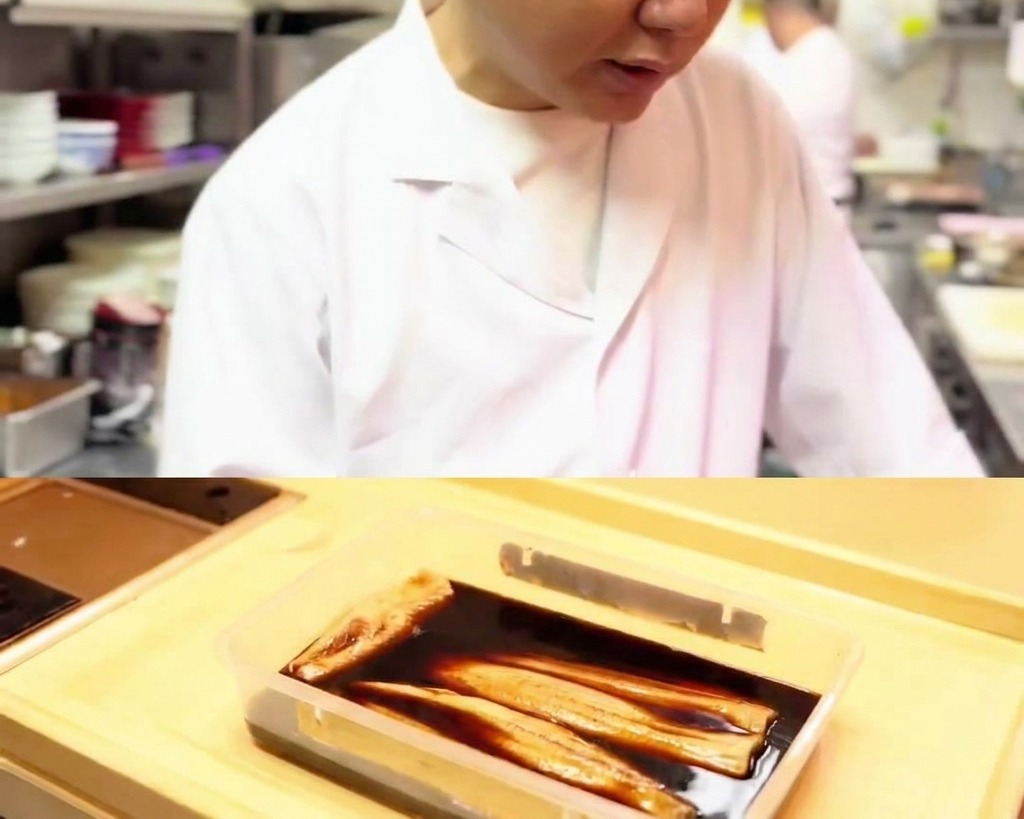 Thin slices of tuna resting and absorbing the dark soy marinade.