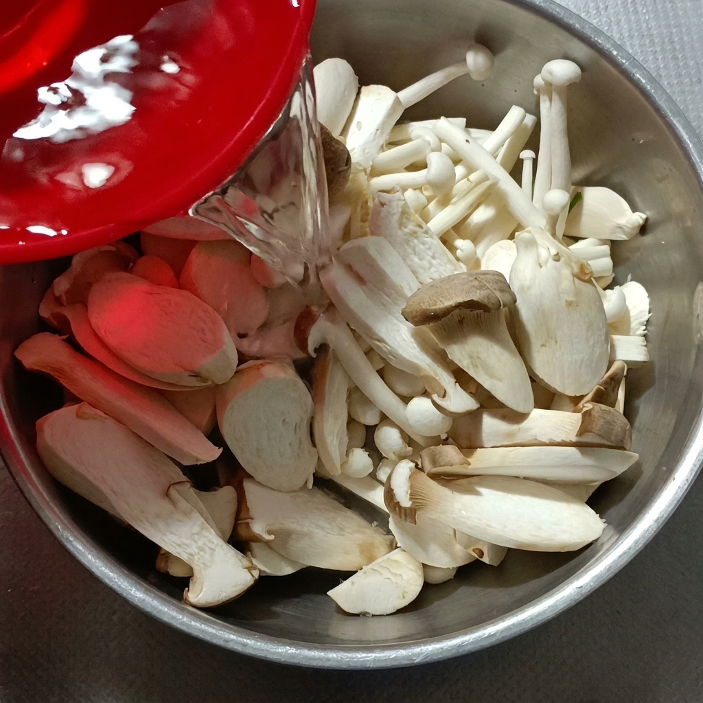 Clean water being poured into a bowl containing various cut mushrooms.
