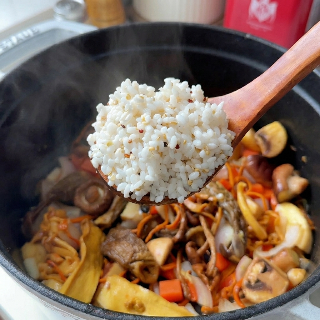 A wooden spoon lifting a scoop of white rice mixed with small quinoa grains over a pot containing various sliced mushrooms and carrots.