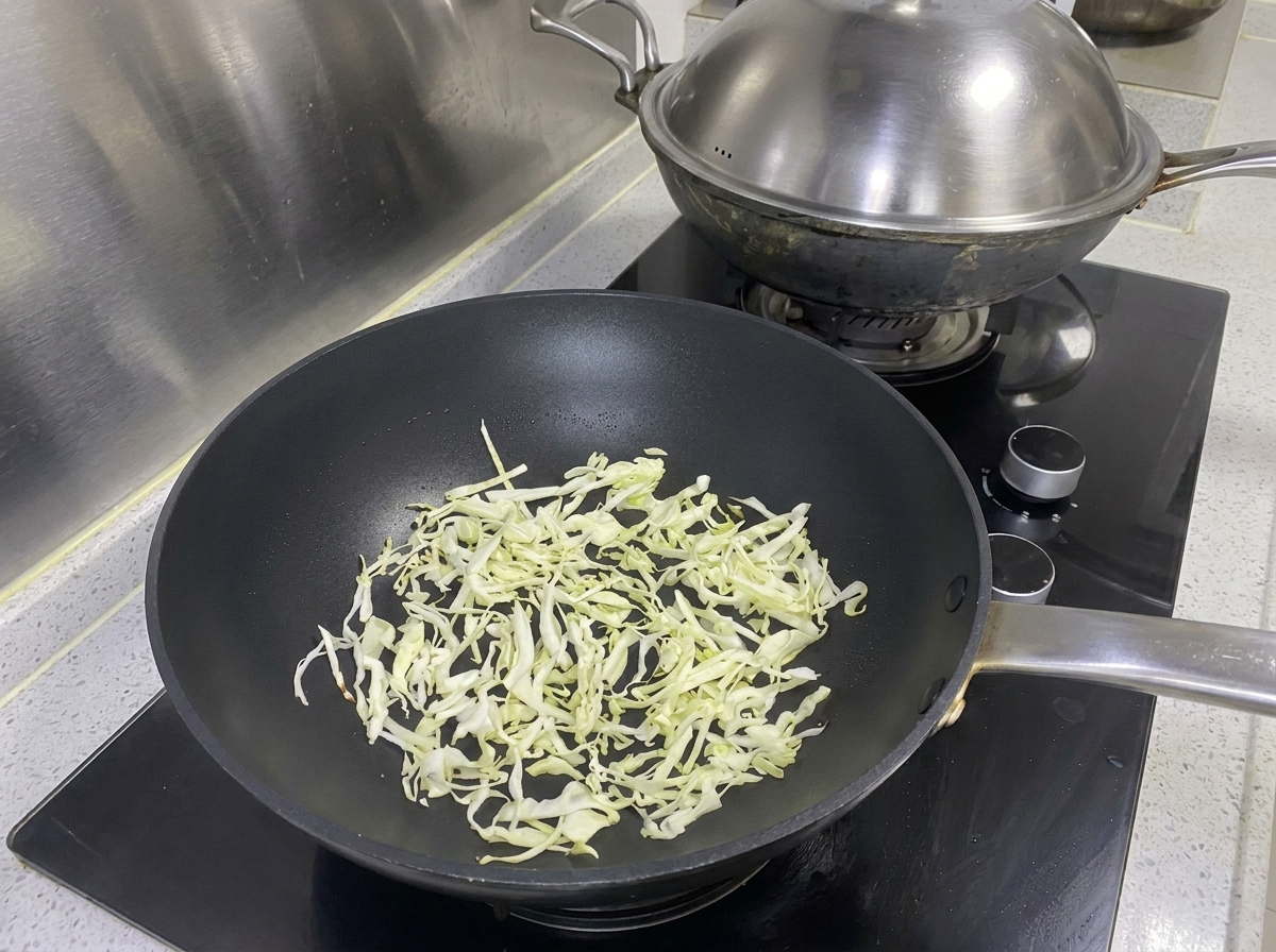Dark oyster sauce being added to the raw minced meat mixture.