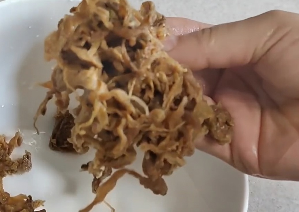 Finely chopped pickled dried cabbage prepared for the ramen soup base.
