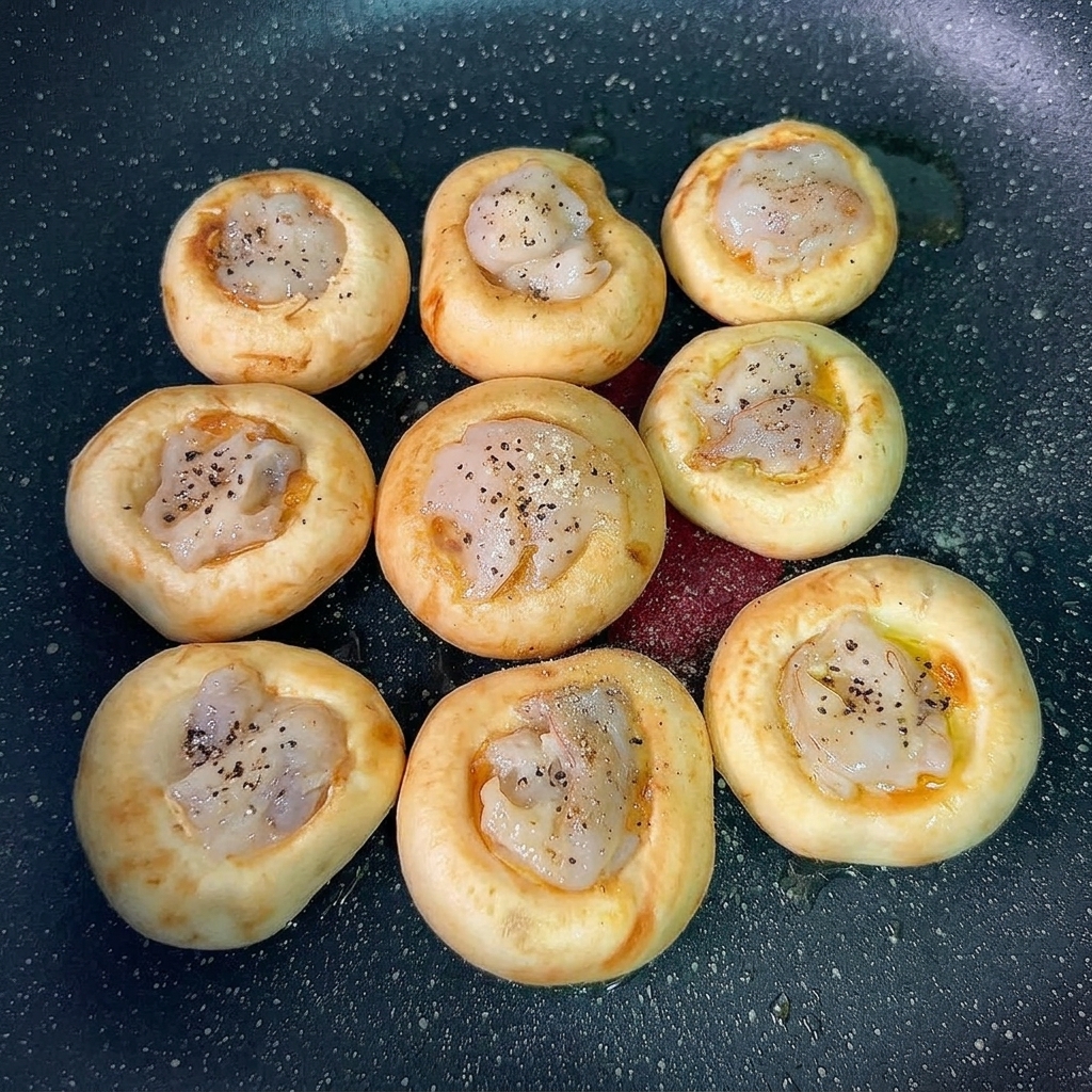 Seasoned shrimp-topped mushroom caps ready to serve.