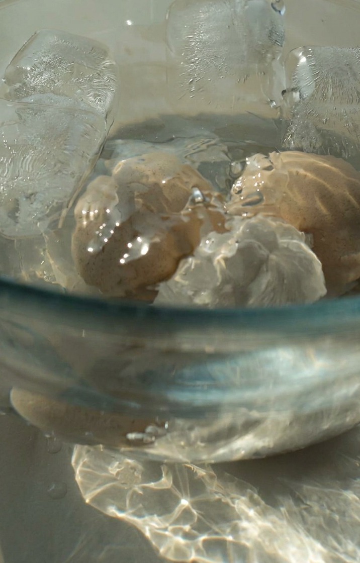 Peeled soft-boiled eggs ready for the marinade.