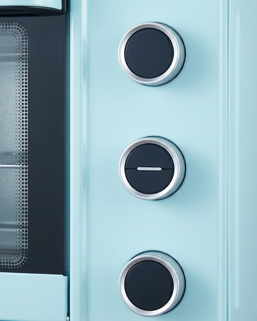 A dial setting on a blue oven indicating the temperature and baking process.