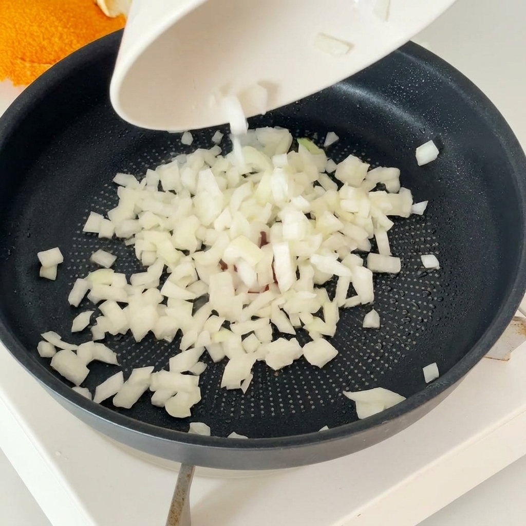 A round, shaped 120g hamburger patty being prepared by hand.