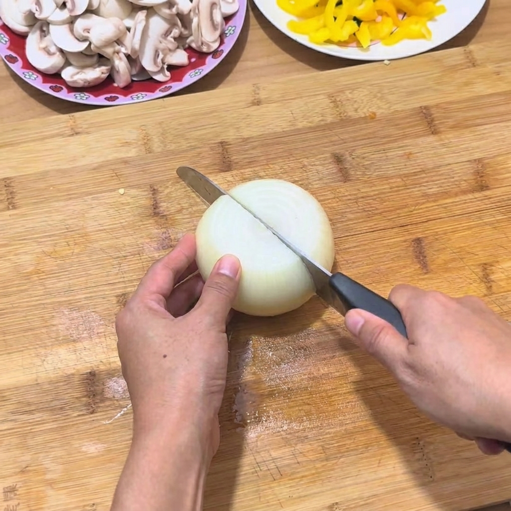 Hands slicing a white onion on a wooden cutting board with a sharp knife.
