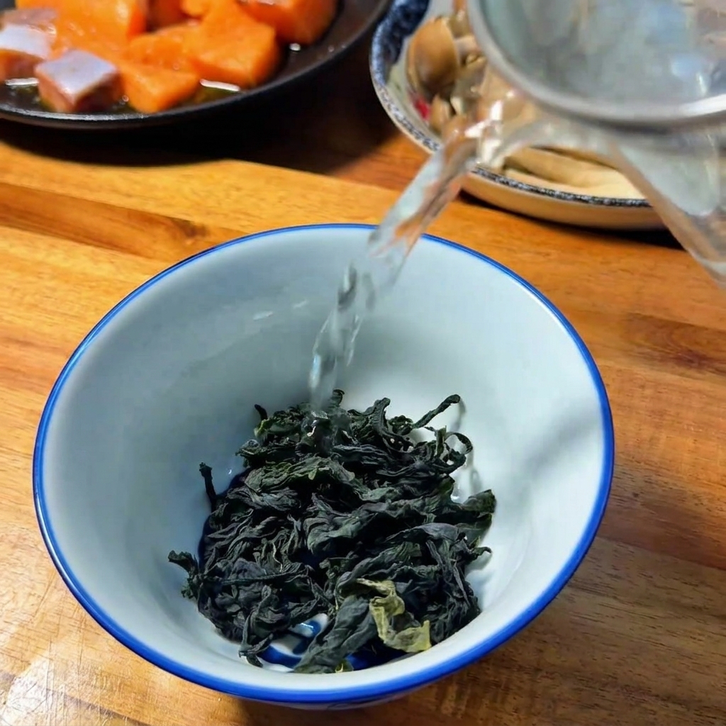 Dried wakame seaweed being covered in hot water to rehydrate.