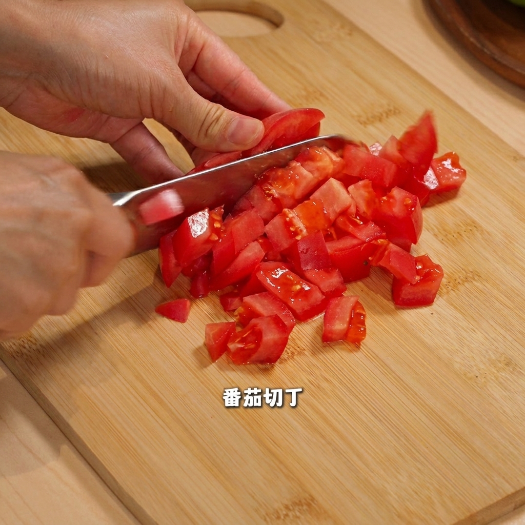 Yellow and red bell peppers sliced and diced into pieces on a wooden cutting board.