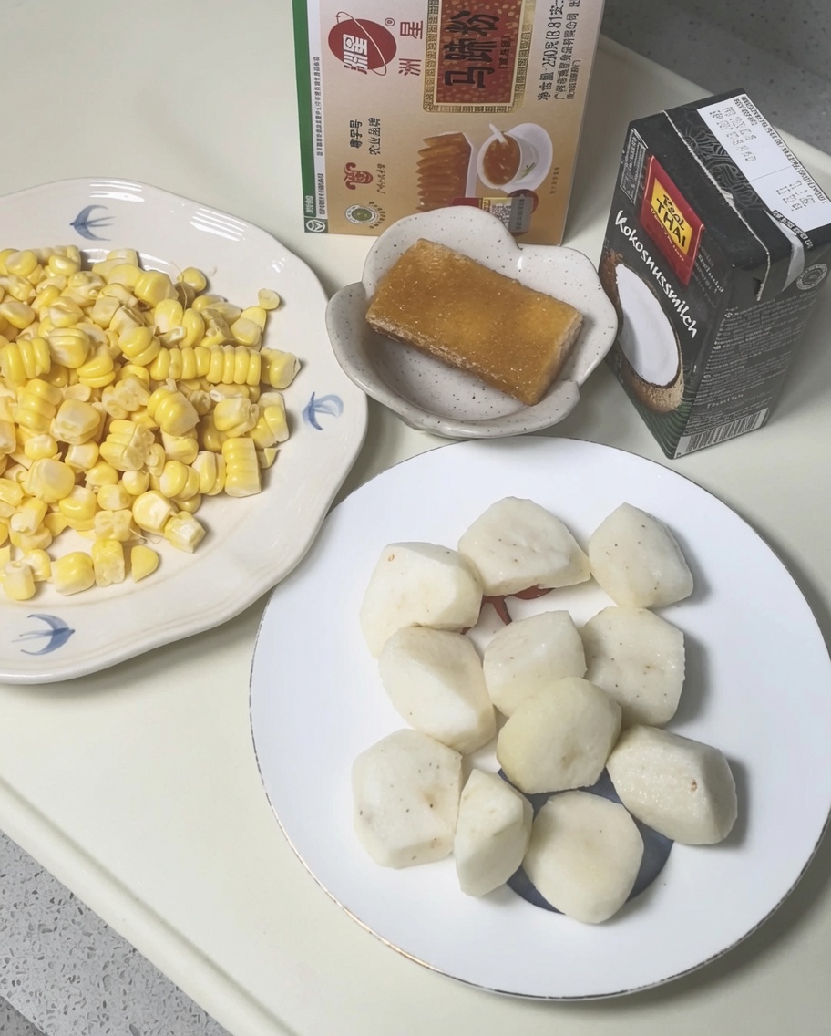 Peeled water chestnuts being crushed inside a plastic bag with a heavy cleaver.