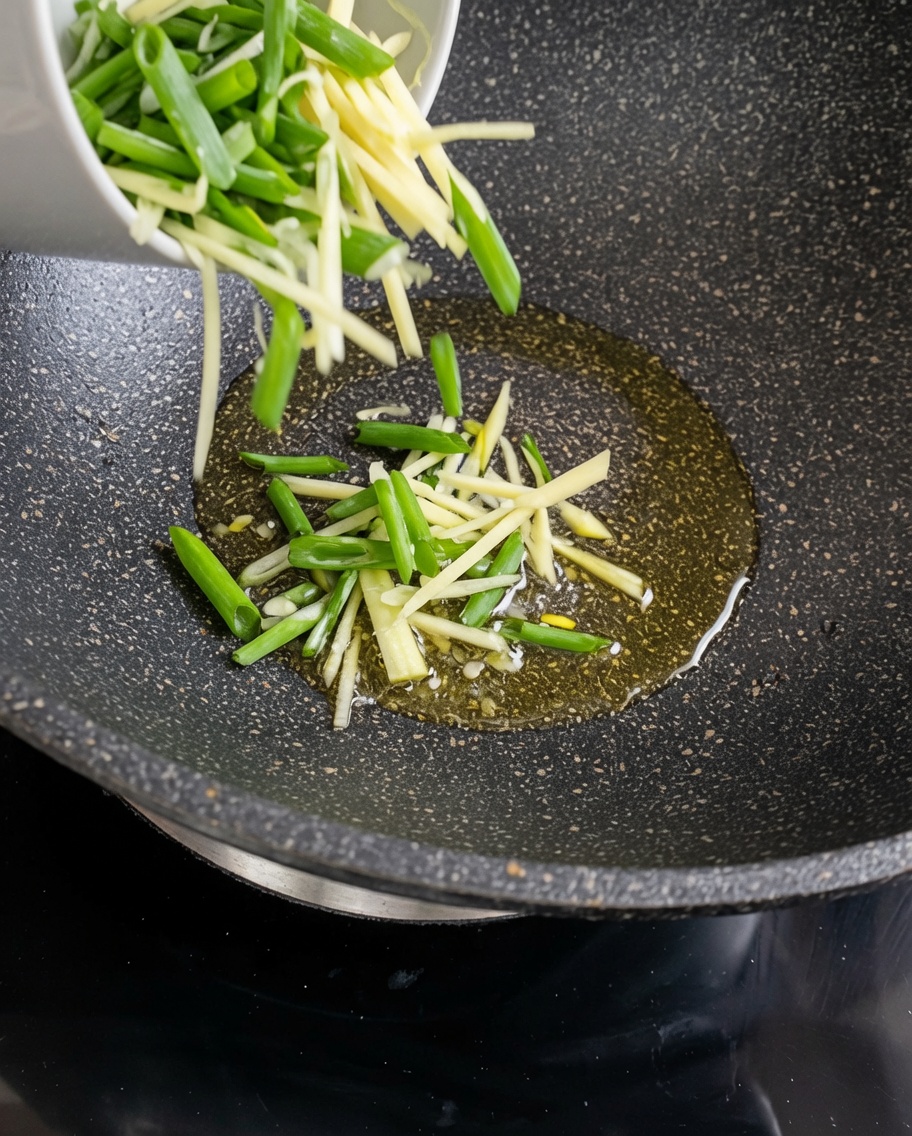 Raw potato strips being stir-fried in a hot, oiled wok.