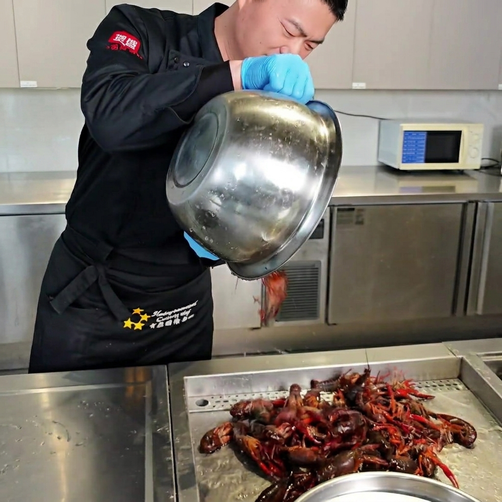 Fresh crawfish being scrubbed under running water.
