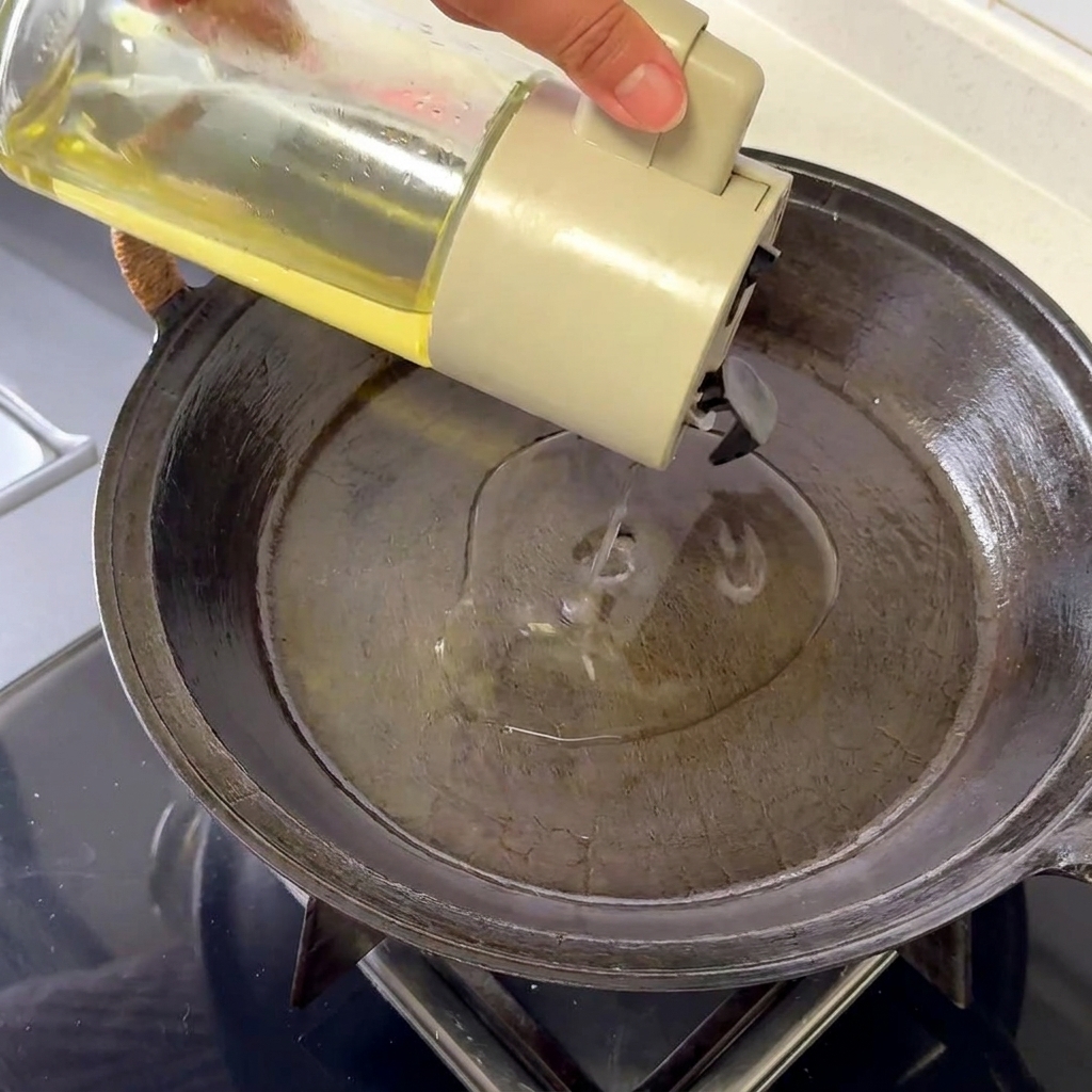 A single egg frying in a hot pan, showing bubbling whites and crispy, golden-brown edges.