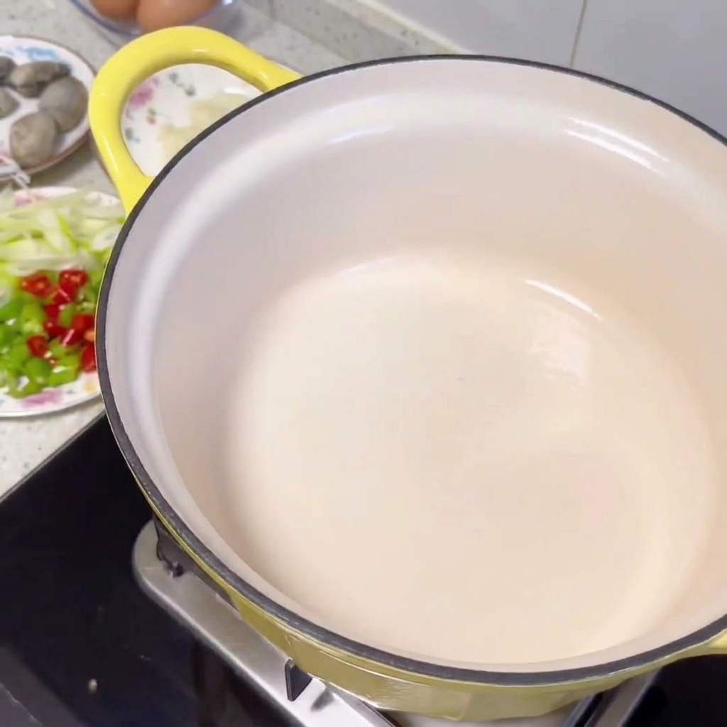 Beef slices browning in a hot pot, releasing their own juices.
