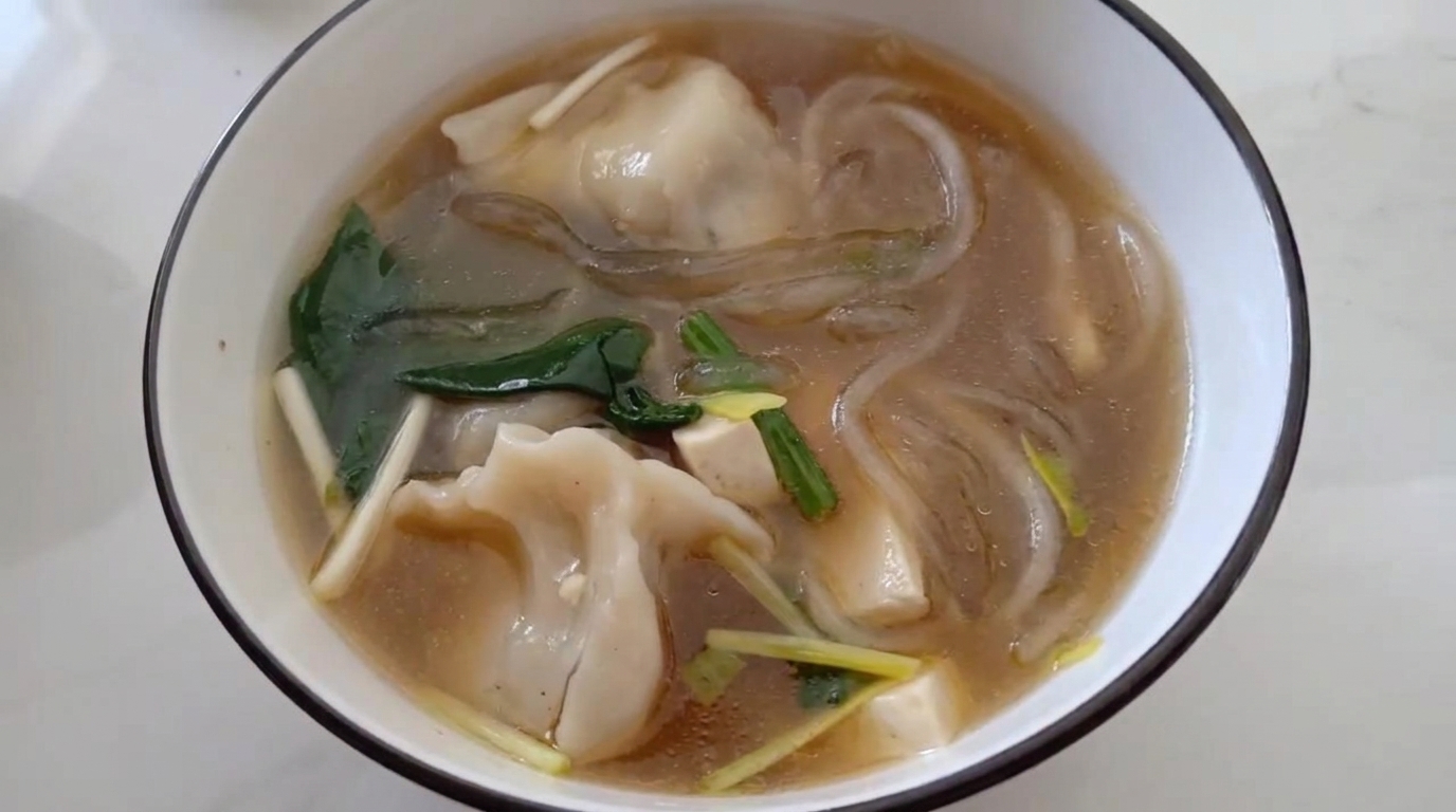 Comforting Dumpling Soup with Vermicelli and Spinach