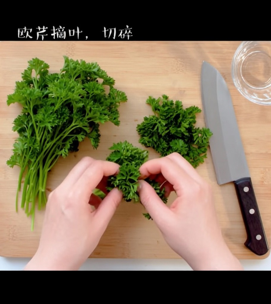 Fresh green parsley leaves being finely chopped on a wooden cutting board.