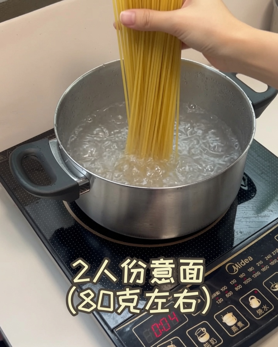 A close-up view of dried spaghetti strands being submerged into a pot of rapidly bubbling boiling water.