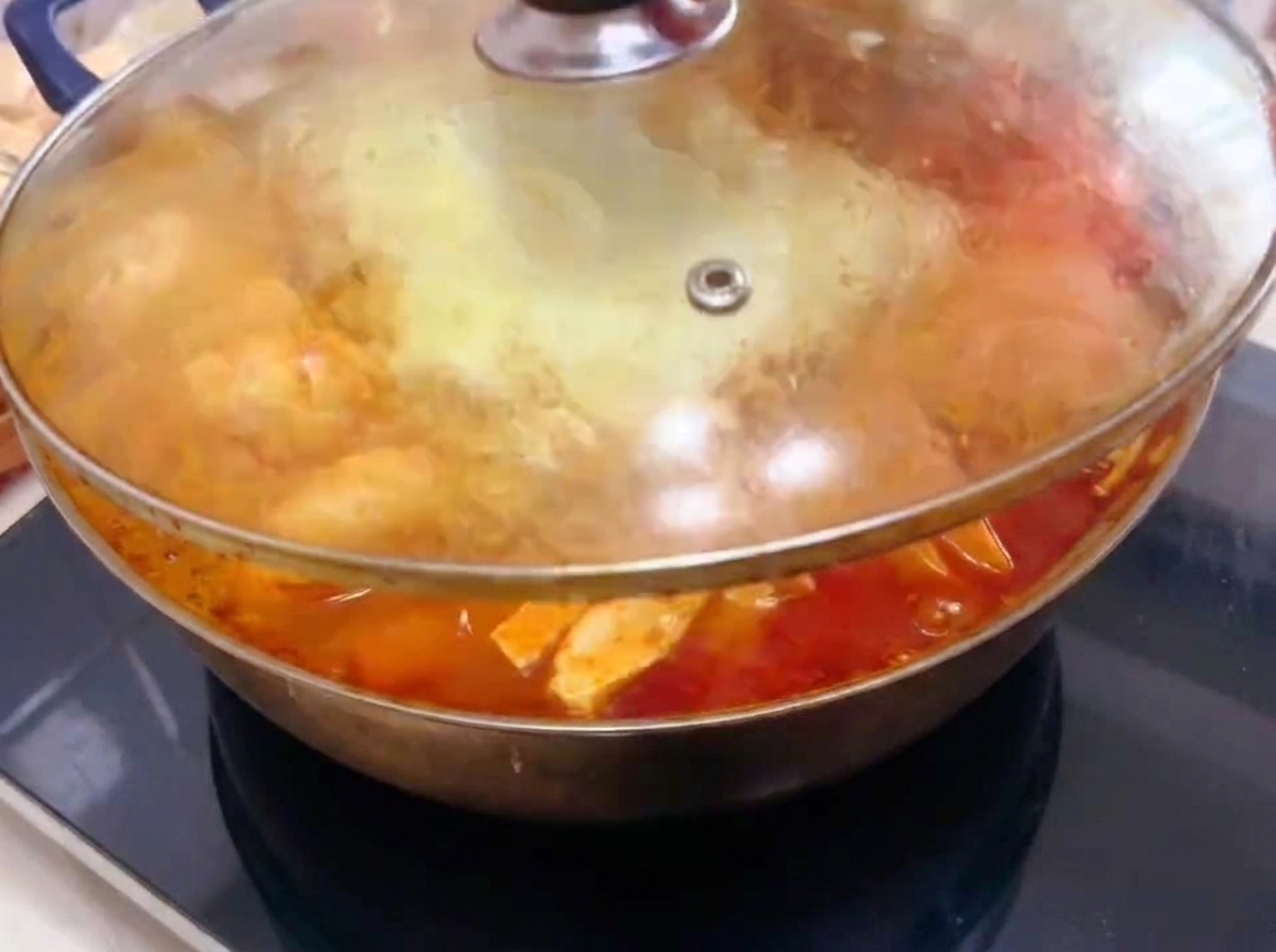 The glass lid covering the pot while the food cooks and the broth bubbles.