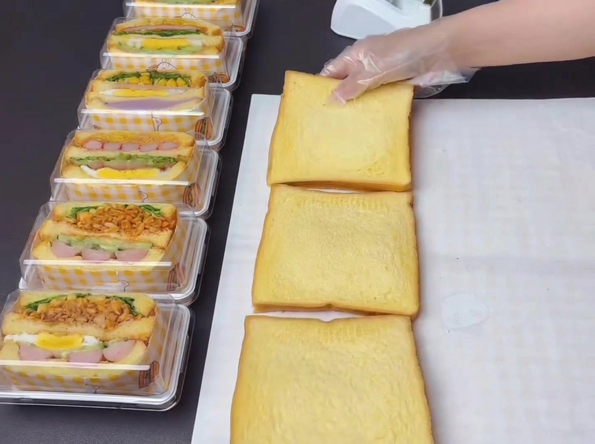 Three slices of pumpkin-flavored toast arranged side by side with sweet salad dressing freshly squeezed onto them.