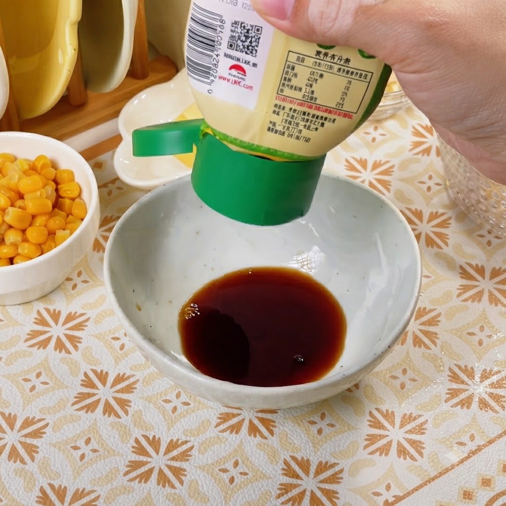 A white bowl containing dark sauce ingredients being stirred with a spoon.