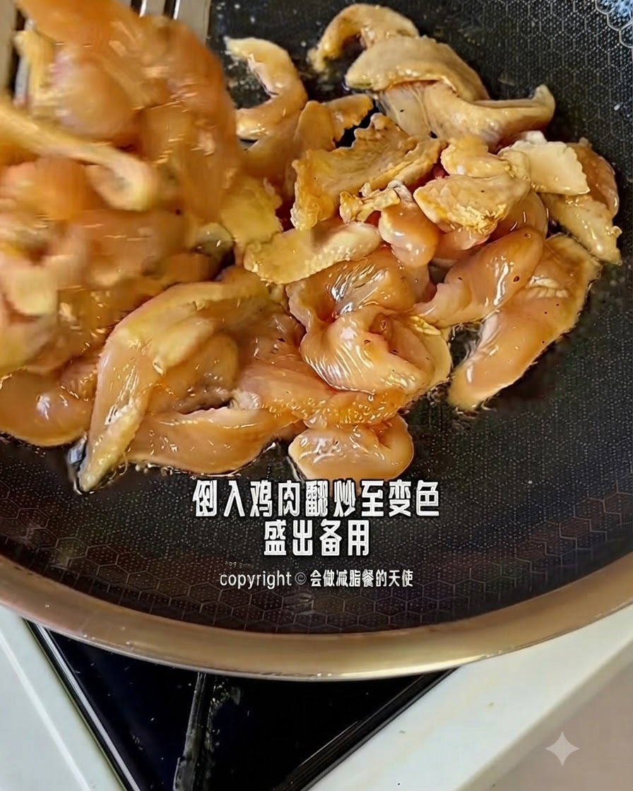 Marinated chicken pieces cooking and changing color in a hot pan.