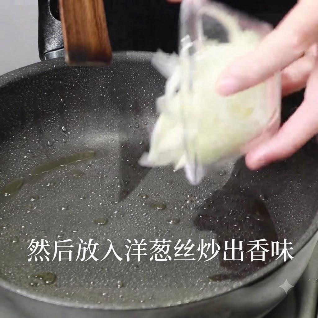 Sliced onions being poured from a clear container into a hot oiled pan.