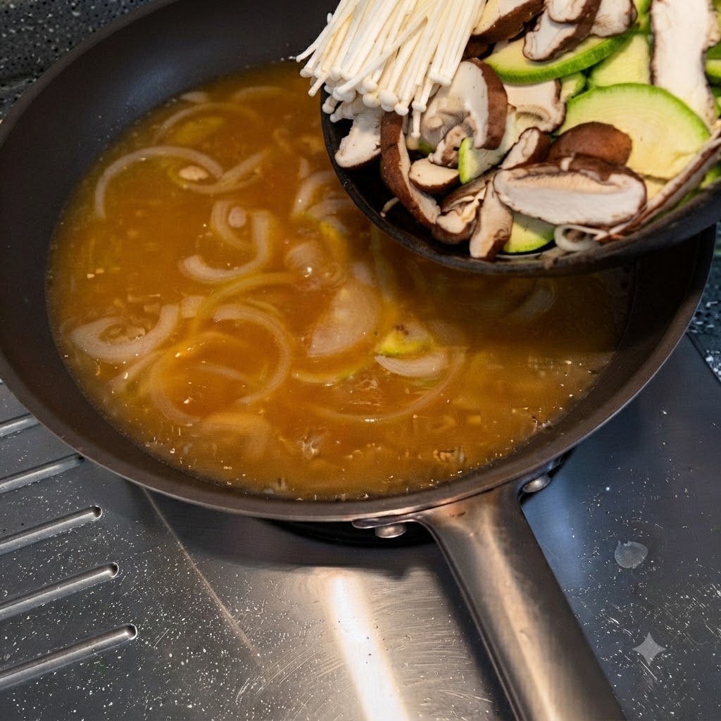 A plate of sliced zucchini, enoki mushrooms, and shiitake mushrooms being tipped into a pan of seasoned broth.