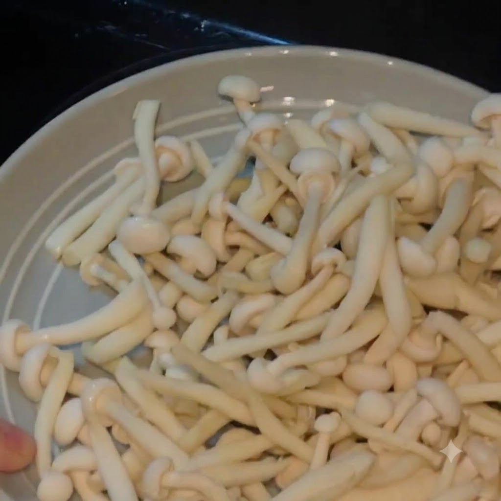 Seafood mushrooms on a plate, ready to be added to the pot.