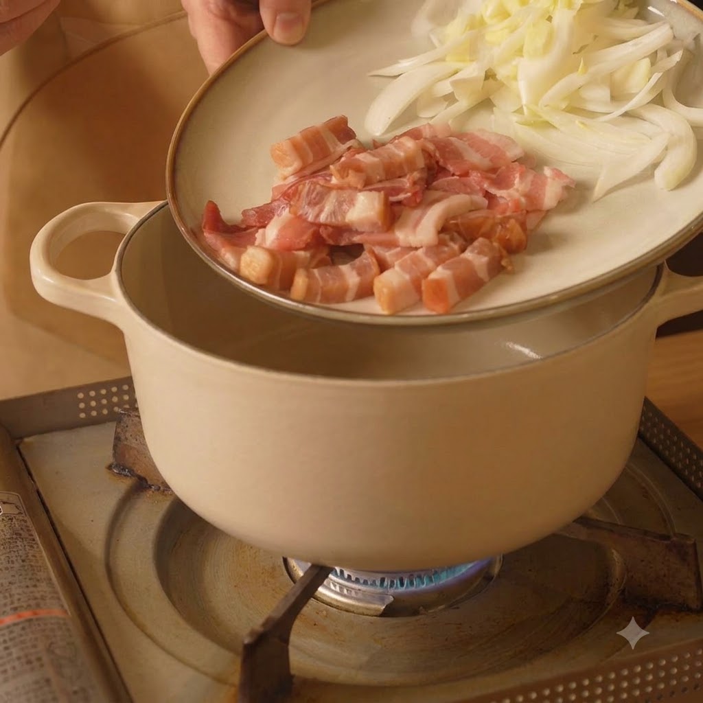 A plate holding sliced bacon and onions being tipped over a white cooking pot on a stove.