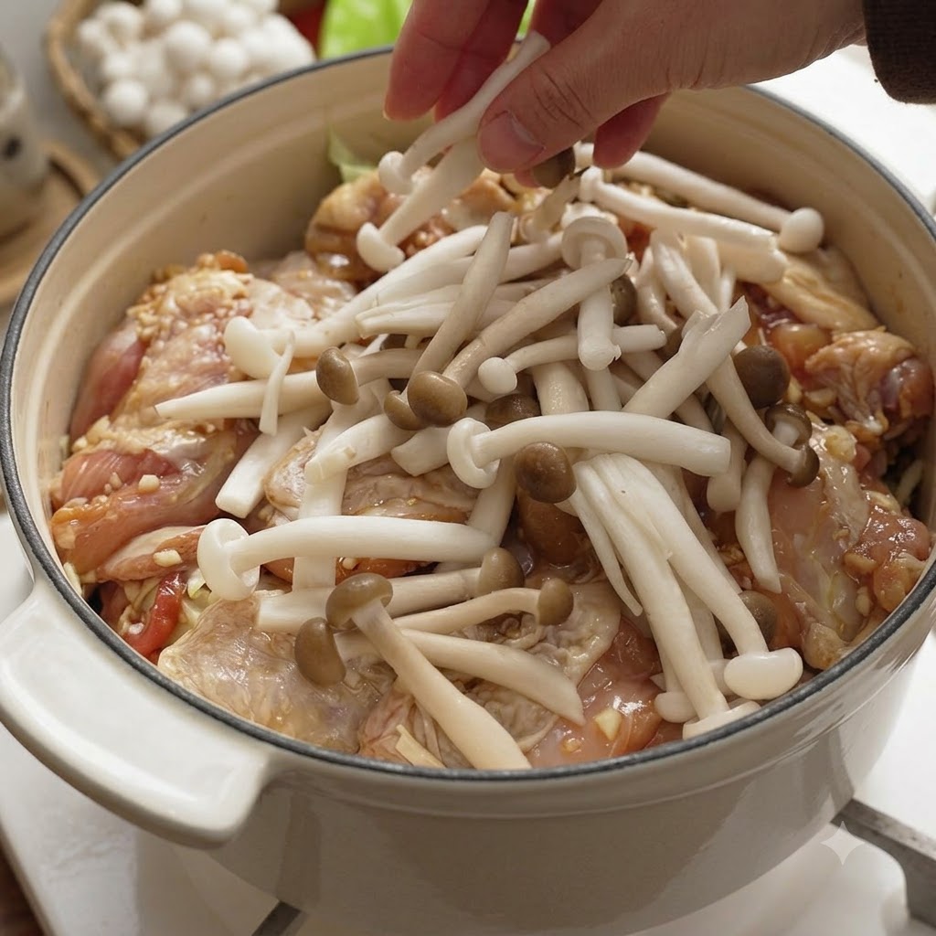 Fresh shimeji and scored shiitake mushrooms being arranged on top of the chicken layer in the pot.