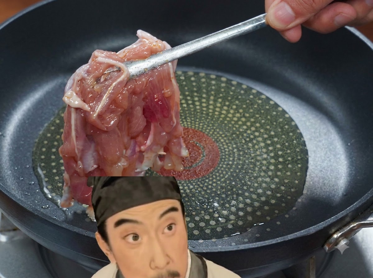 A piece of marinated chicken being placed with tongs into a frying pan with hot oil.
