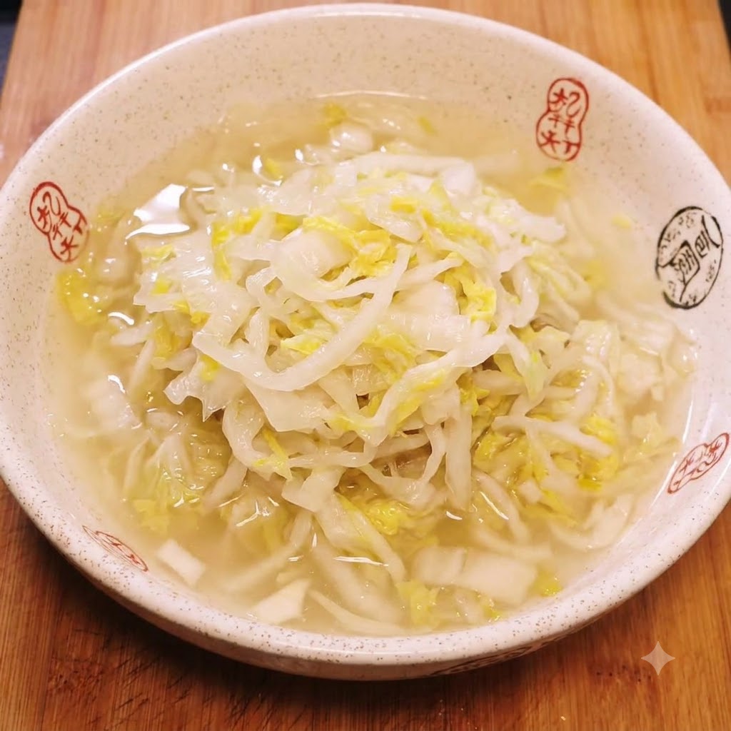 A ceramic bowl containing soaked shredded sauerkraut submerged in water.