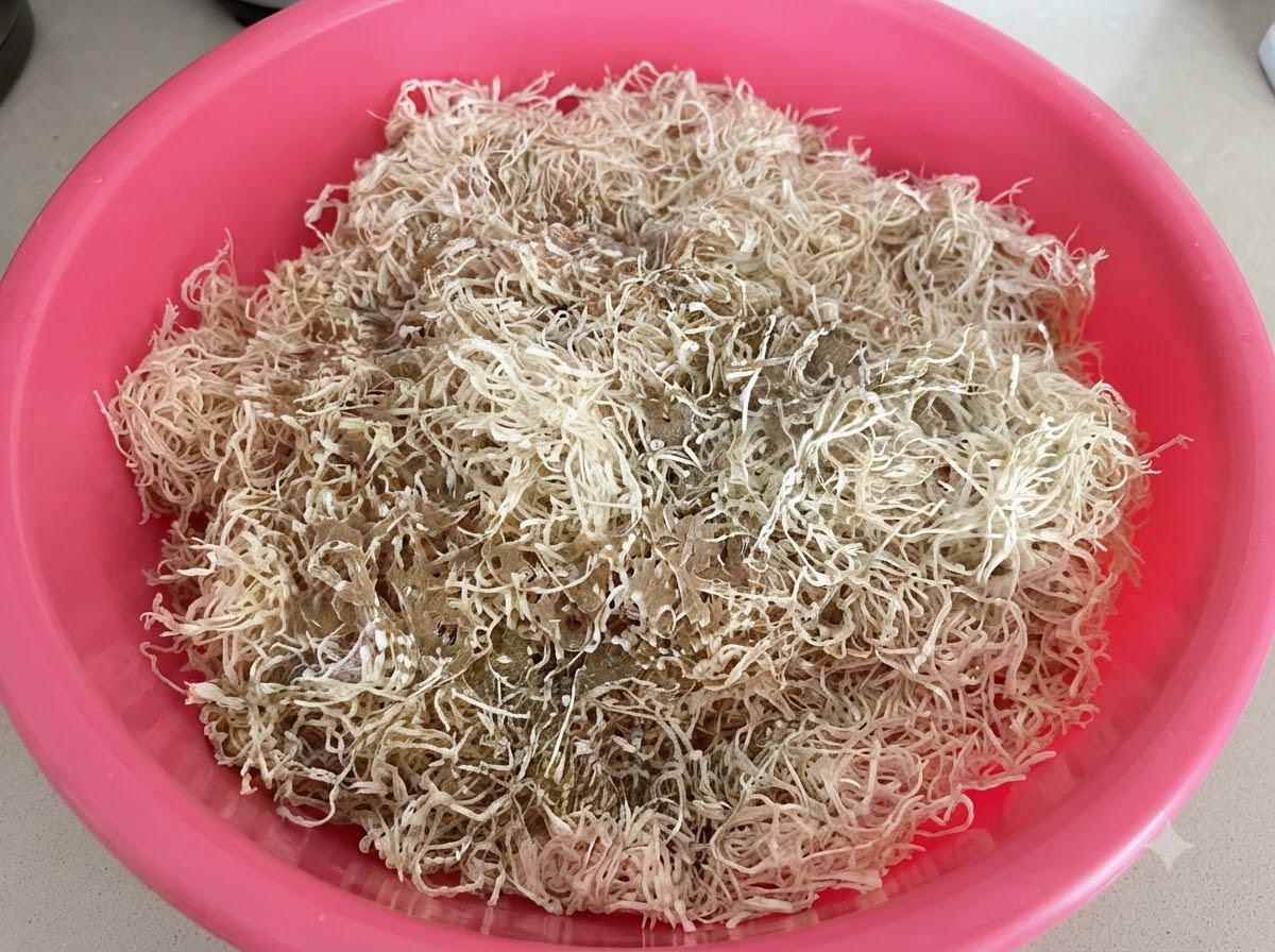 Spices, chili powder, and ground rice flour resting on top of shredded sun-dried radishes in a pink basin.