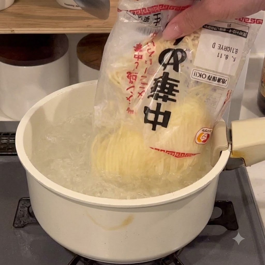 A package of noodles being emptied into a large pot of boiling water on a stove burner.