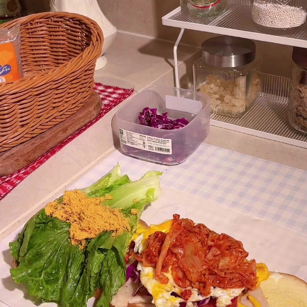 Chicken floss being sprinkled over the lettuce and other fillings.