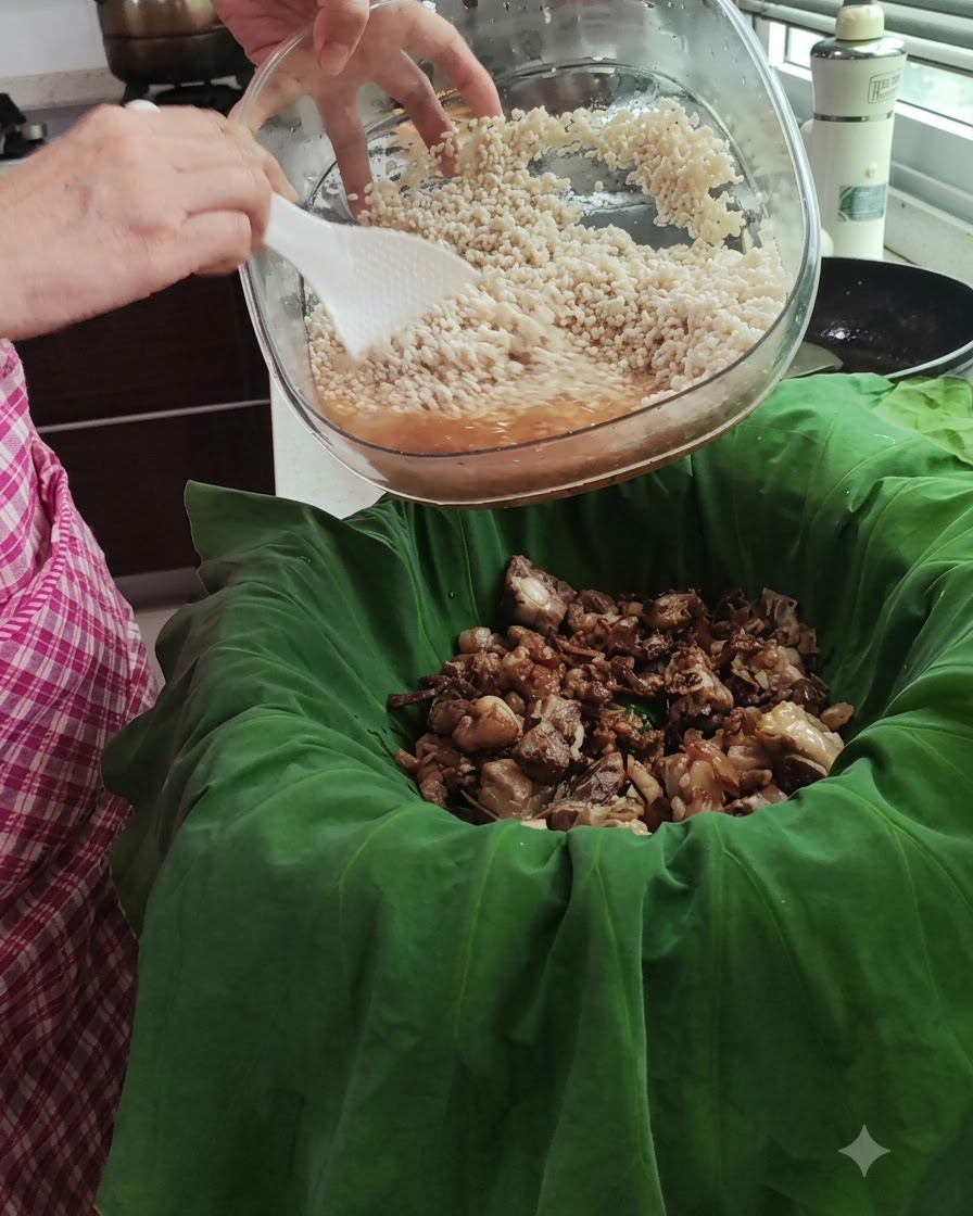 Soaked rice in a glass bowl being poured over the bed of cooked pork inside a green lotus leaf.