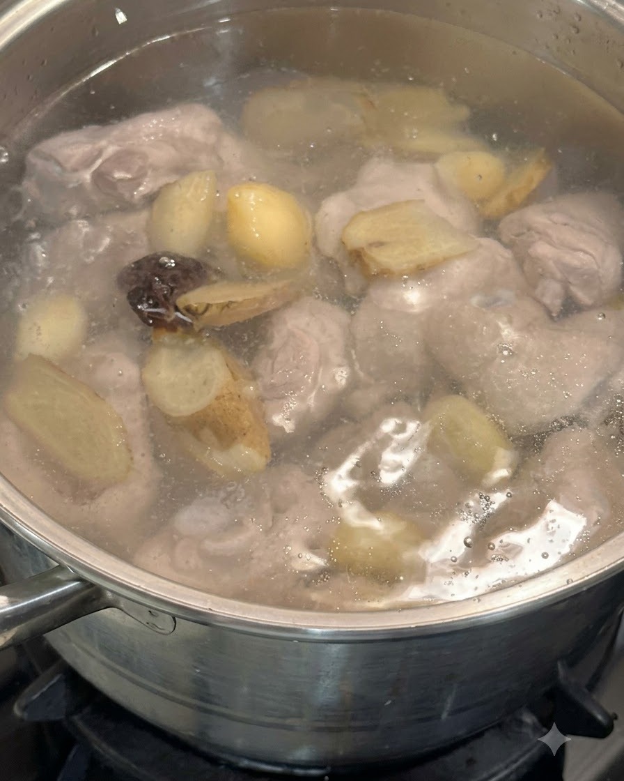 Shiitake mushrooms and mushroom soaking water being added to the pot containing chicken legs and aromatics.