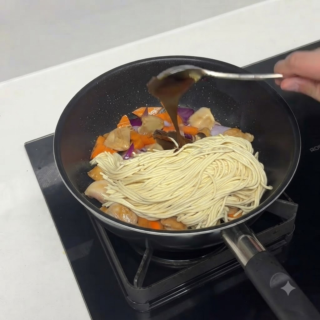 Curry paste or curry blocks being added to the pan ingredients.