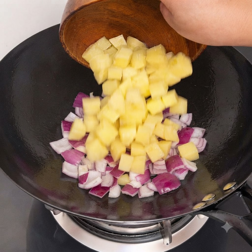 Chopped purple onions being poured into a hot wok for stir-frying.