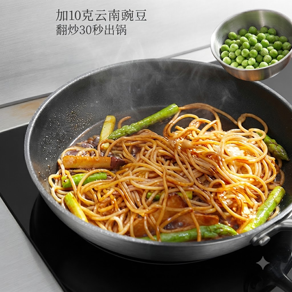 Green sweet peas being poured from a small metal bowl into the pan with the stir-fried pasta.