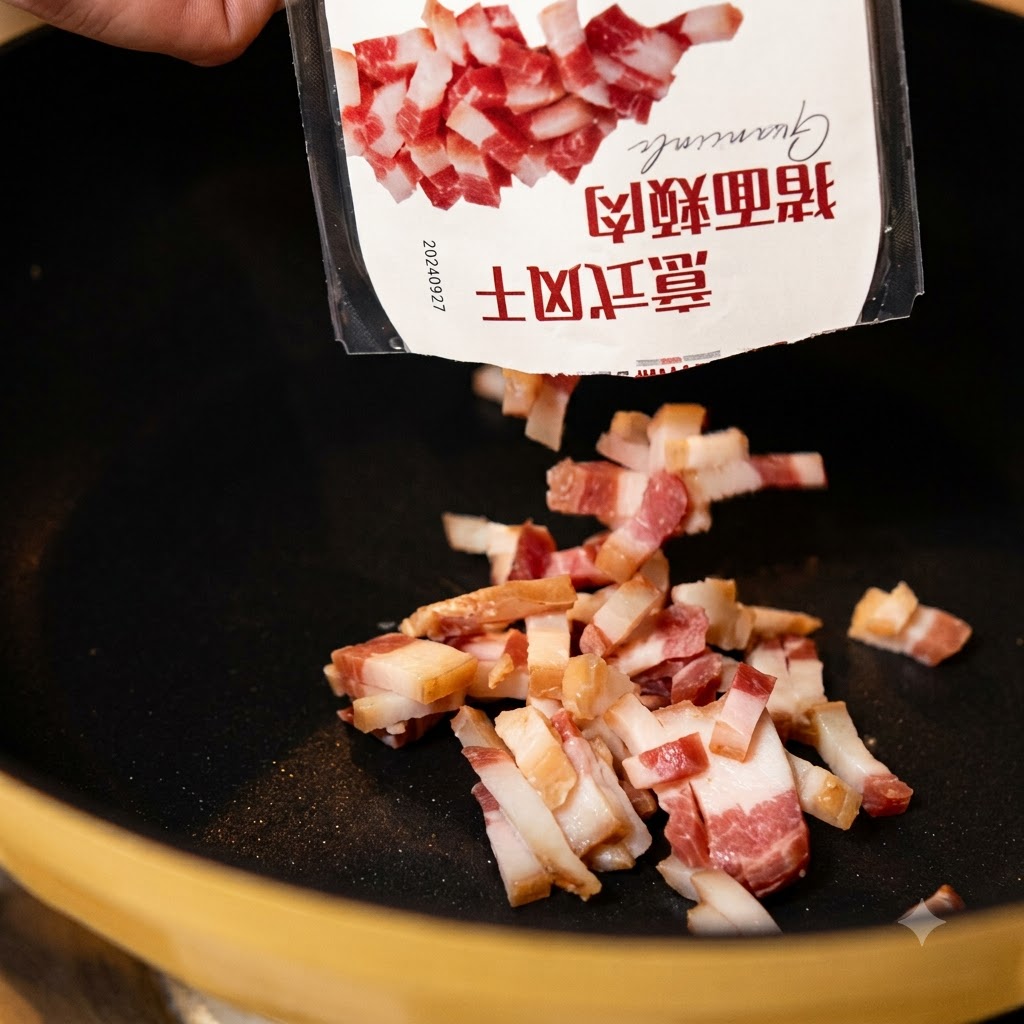 Pieces of cured pork cheek falling from a package into a heated black frying pan.