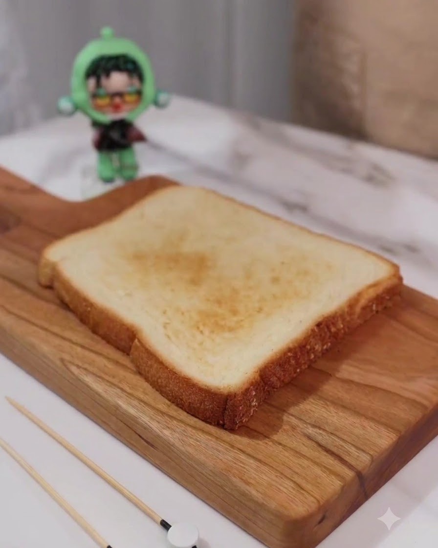 Fresh green lettuce leaves laid neatly on a single slice of golden toasted bread.