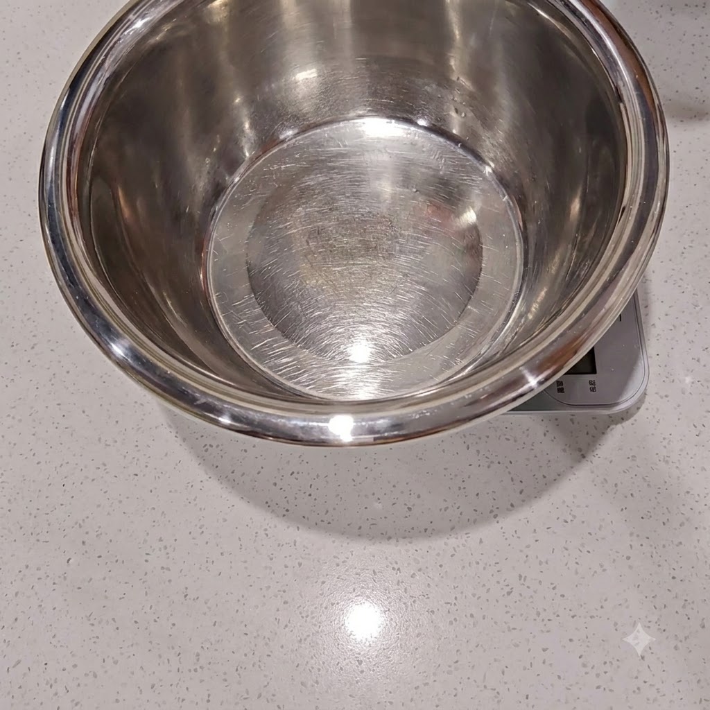 Water and dry yeast being poured into a mixing bowl and stirred to dissolve.