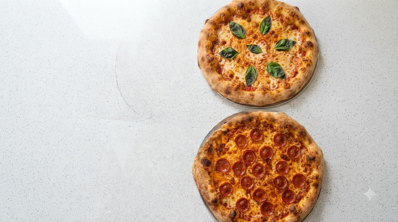 Two freshly baked classic Italian pizzas presented side-by-side: a golden Margherita with fresh basil and a savory Salami pizza with bubbling melted cheese.
