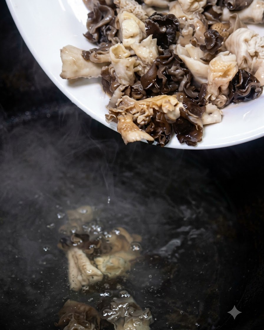 Prepared mushrooms being poured from a white plate into a pot of boiling water.