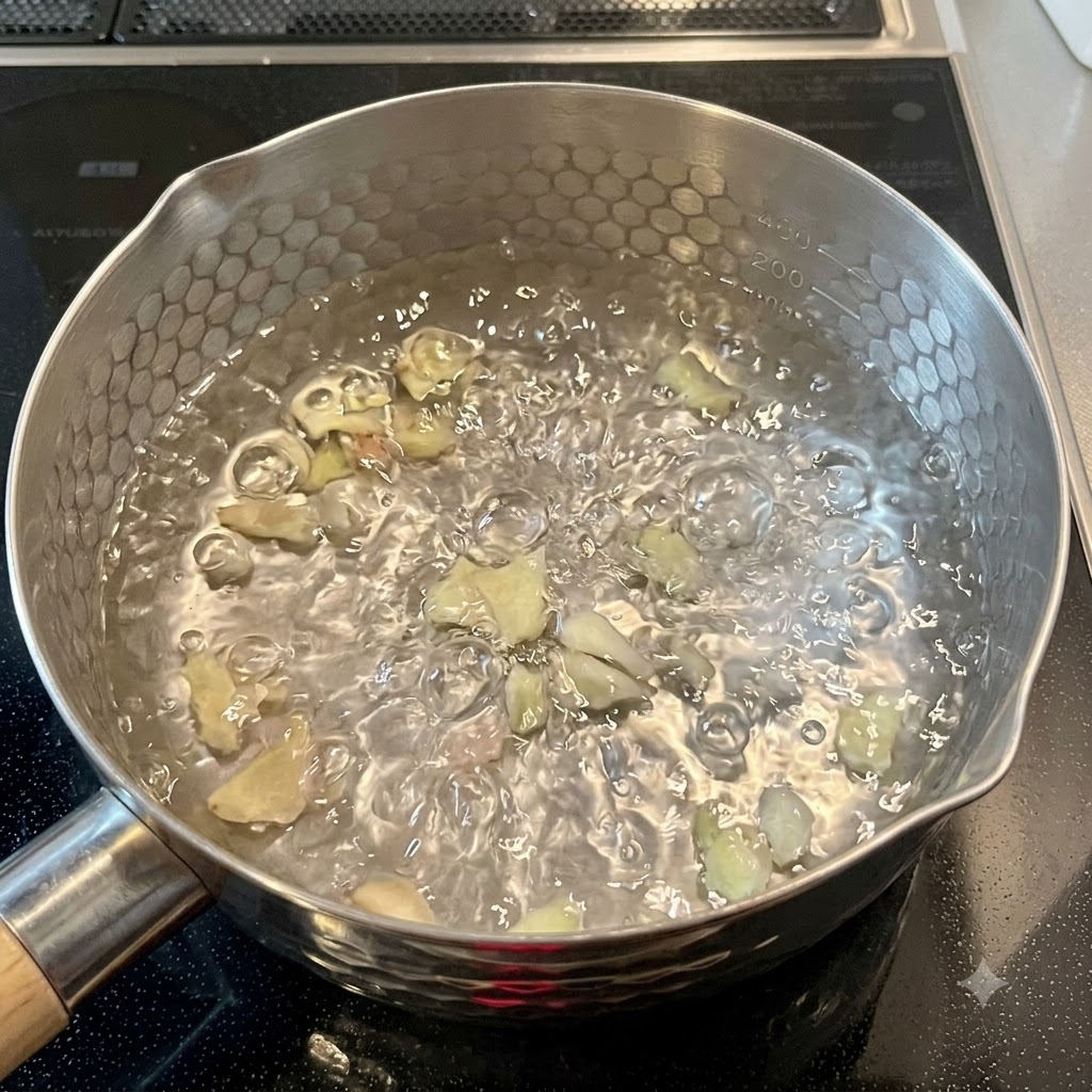 Dry noodles cooking inside a bubbling pot of boiling water on the stovetop.