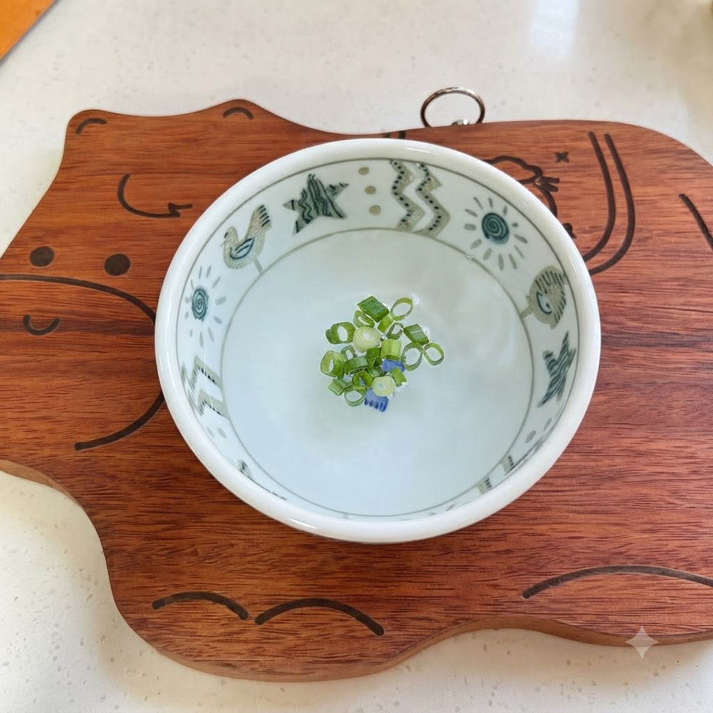 White sugar, chicken bouillon powder, light soy sauce, oyster sauce, starch, and water being combined in a small ceramic bowl.