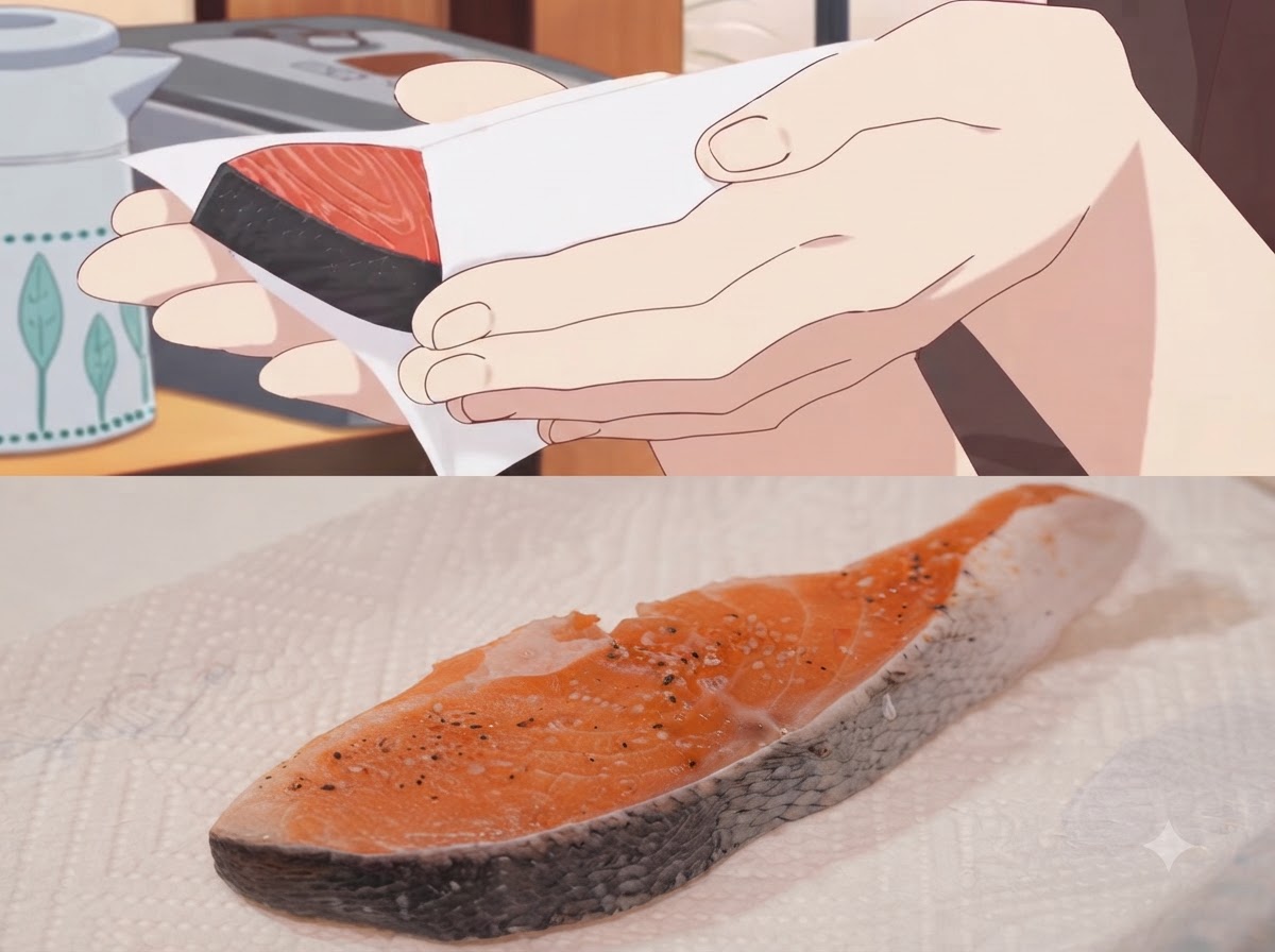 A piece of seasoned salmon being wiped clean with a paper towel.