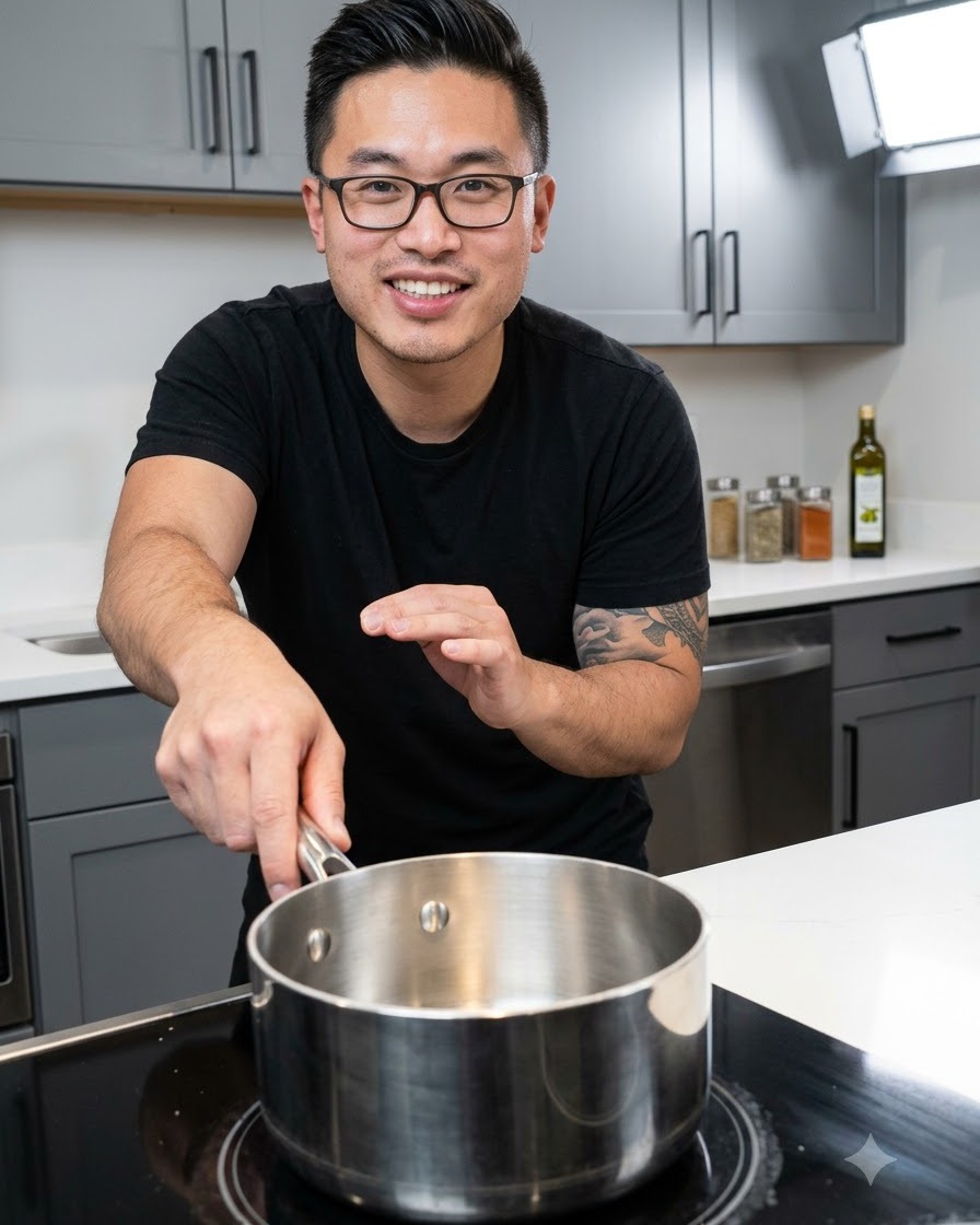 Sauce ingredients being combined inside a stainless steel saucepan placed on a black stovetop.